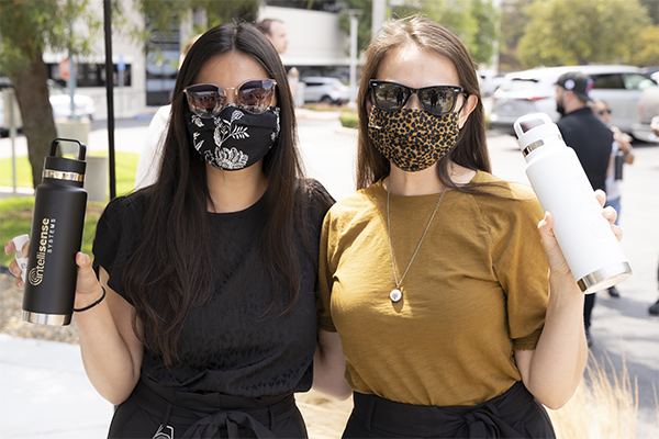Intellisense System Employees Return To Work Intellisense Systems Employees Holding Water Bottles